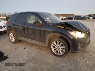 2014 Mazda CX-5 Grand Touring with VIN JM3KE4DY9E0366667, listed as a Copart auction lot 88707365 with 140,115 mi miles and Salvage Title. Bid and sale history available at carsss.com. Image 4.