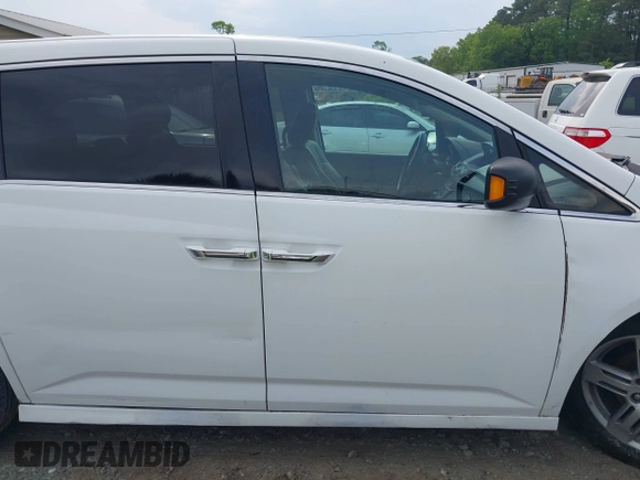 2011 Honda Odyssey Touring with VIN 5FNRL5H90BB066177, listed as a IAAI auction lot 42053368 with 239,205 mi miles and . Bid and sale history available at DreamBid. Image 13.