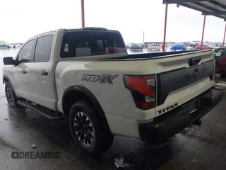 2021 Nissan Titan Pro-4X z VIN 1N6AA1ED7MN511004, wystawiony jako IAAI lot #42184599 z przebiegiem 36 086 mil mil oraz . Historia ofert i sprzedaży dostępna na DreamBid. Obrazek 3.
