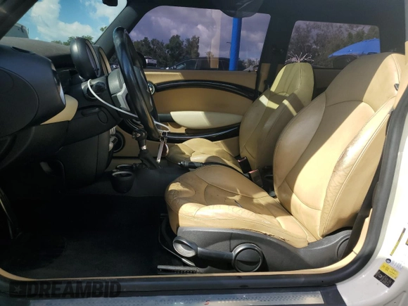 2010 MINI Hardtop S with VIN WMWMF7C5XATW89025, listed as a Copart auction lot 56106705 with 141,216 mi miles and Salvage title. Bid and sale history available at DreamBid. Image 7.