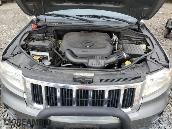 2011 Jeep Grand Cherokee Laredo with VIN 1J4RR4GG7BC578129, listed as a Copart auction lot 53147775 with 157,127 mi miles and Salvage title. Bid and sale history available at DreamBid. Image 12.