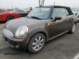 2009 MINI Convertible z VIN WMWMR335X9TU96627, wystawiony jako Copart lot #86551094 z przebiegiem 91 843 mil mil oraz Czysty tytuł • Clean title. Historia ofert i sprzedaży dostępna na DreamBid. Obrazek 1.