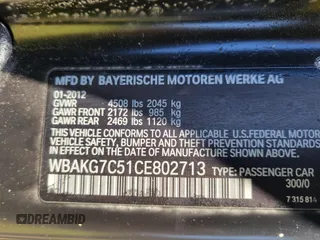 2012 BMW 3 Series 335i with VIN WBAKG7C51CE802713, listed as a IAAI auction lot 42032267 with 124,349 mi miles. Bid and sale history available at carsss.com. Image 9.