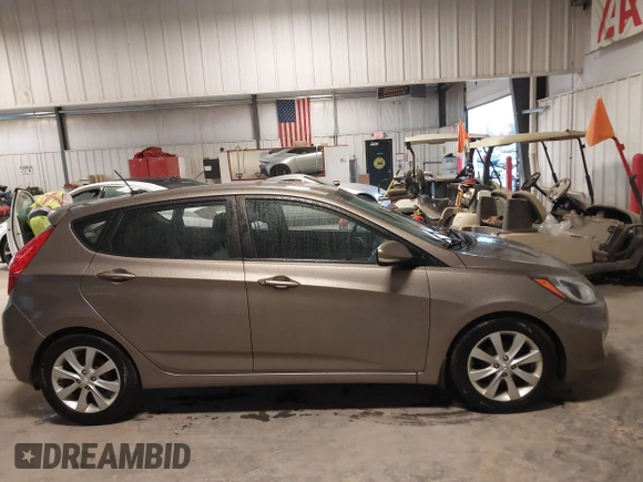 2013 Hyundai Accent SE with VIN KMHCU5AE6DU097353, listed as a IAAI auction lot 41937225 with 173,447 mi miles. Bid and sale history available at carsss.com. Image 13.