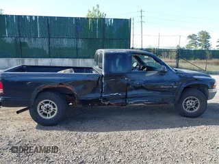 1999 Dodge Dakota SLT with VIN 1B7GG22X8XS115282, listed as a IAAI auction lot 42136576 with 220,465 mi miles and . Bid and sale history available at carsss.com. Image 13.