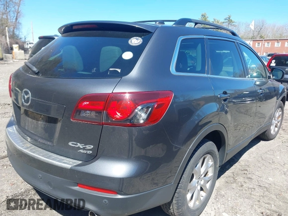 2015 Mazda CX-9 Touring with VIN JM3TB3CV1F0461854, listed as a IAAI auction lot 42068299 with 128,124 mi miles. Bid and sale history available at carsss.com. Image 4.