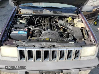 1993 Jeep Grand Cherokee Laredo with VIN 1J4GZ58S8PC656490, listed as a Copart auction lot 49377485 with 236,215 mi miles and Salvage Title. Bid and sale history available at carsss.com. Image 12.