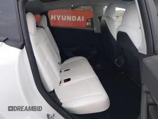 2023 Tesla Model Y Long Range with VIN 7SAYGDEE2PF874729, listed as a IAAI auction lot 41518376 with 10,927 mi miles and . Bid and sale history available at DreamBid. Image 8.