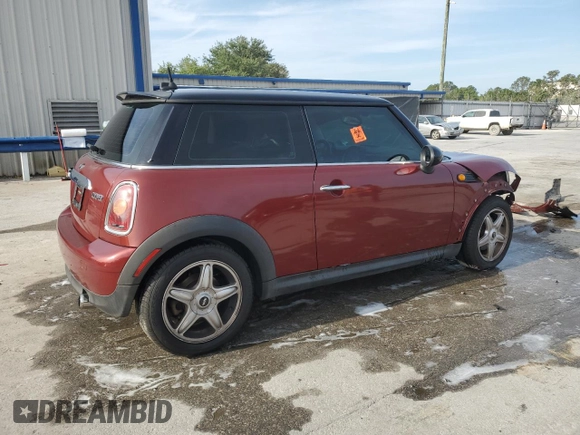 2007 MINI Hardtop with VIN WMWMF33577TT52975, listed as a Copart auction lot 53909855 with 127,325 mi miles and Salvage title. Bid and sale history available at DreamBid. Image 3.