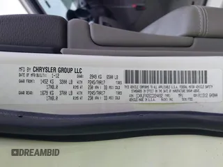 2012 Jeep Grand Cherokee Laredo with VIN 1C4RJFAG5CC224032, listed as a IAAI auction lot 42069334 with 106,614 mi miles. Bid and sale history available at carsss.com. Image 9.