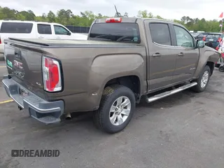 2015 GMC Canyon 2WD SLE with VIN 1GTG5BE38F1229799, listed as a IAAI auction lot 41944801 with 71,165 mi miles. Bid and sale history available at carsss.com. Image 4.