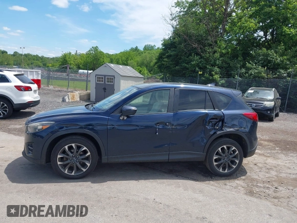 2016 Mazda CX-5 Grand Touring z VIN JM3KE4DY1G0817562, wystawiony jako IAAI lot #42289929 z przebiegiem 135 476 mil mil oraz . Historia ofert i sprzedaży dostępna na DreamBid. Obrazek 14.