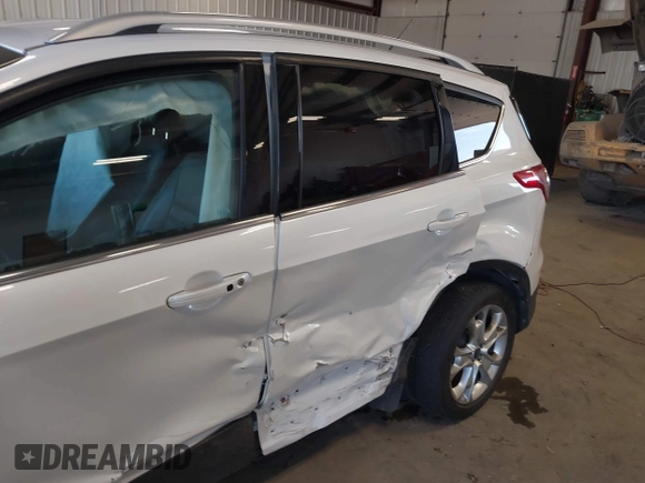 2016 Ford Escape Titanium with VIN 1FMCU9J94GUC28648, listed as a IAAI auction lot 42043761 with 82,509 mi miles and . Bid and sale history available at DreamBid. Image 6.