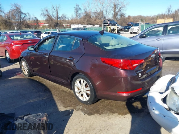 2013 Kia Optima LX z VIN 5XXGM4A71DG186111, wystawiony jako IAAI lot #41189410 z przebiegiem 214 084 mil mil oraz . Historia ofert i sprzedaży dostępna na DreamBid. Obrazek 3.