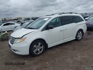 2013 Honda Odyssey Touring with VIN 5FNRL5H99DB041328, listed as a IAAI auction lot 41797520 with 148,523 mi miles and . Bid and sale history available at carsss.com. Image 17.