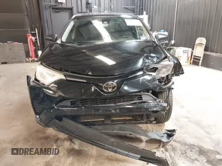 2018 Toyota RAV4 LE with VIN 2T3BFREV7JW768376, listed as a IAAI auction lot 41864571 with 292,147 mi miles. Bid and sale history available at carsss.com. Image 6.