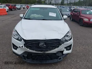 2016 Mazda CX-5 Touring with VIN JM3KE4CY0G0903723, listed as a IAAI auction lot 41966516 with 107,569 mi miles. Bid and sale history available at carsss.com. Image 6.