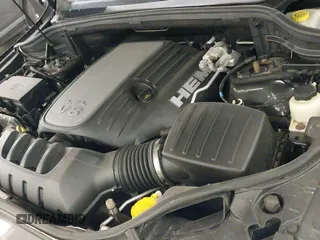 2015 Jeep Grand Cherokee Overland z VIN 1C4RJFCT7FC704149, wystawiony jako IAAI lot #42271696 z przebiegiem 127 825 mil mil oraz . Historia ofert i sprzedaży dostępna na DreamBid. Obrazek 19.