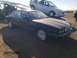 2001 Jaguar XJ with VIN SAJDA23C31LF28667, listed as a Copart auction lot 76983144 with 87,542 mi miles and Clean title. Bid and sale history available at DreamBid. Image 4.