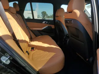 2025 BMW X5 sDrive40i with VIN 5UX13EU05S9W82678, listed as a Copart auction lot 49857255 with 9,901 mi miles and Salvage Title. Bid and sale history available at carsss.com. Image 11.
