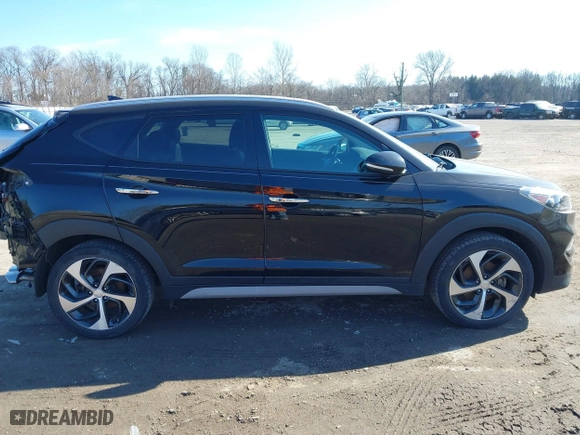 2018 Hyundai Tucson Value with VIN KM8J3CA26JU700642, listed as a IAAI auction lot 41655085 with 80,903 mi miles. Bid and sale history available at carsss.com. Image 13.