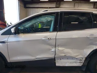 2016 Ford Escape Titanium with VIN 1FMCU9J94GUC28648, listed as a IAAI auction lot 42043761 with 82,509 mi miles and . Bid and sale history available at DreamBid. Image 14.