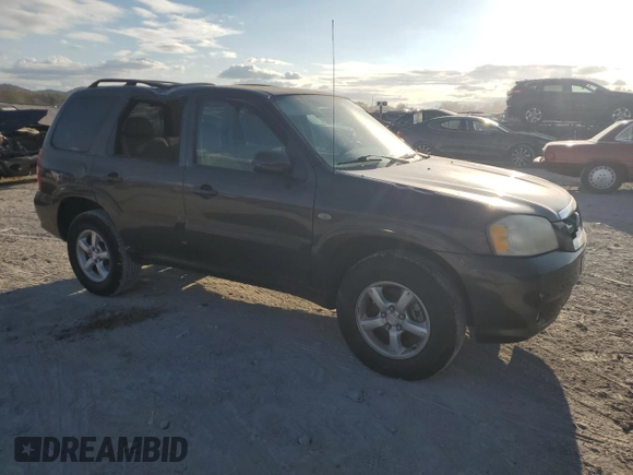 2006 Mazda Tribute S with VIN 4F2YZ04116KM23873, listed as a Copart auction lot 79926084 with 67,142 mi miles and Salvage Title. Bid and sale history available at DreamBid. Image 4.