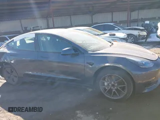 2023 Tesla Model 3 with VIN 5YJ3E1EA9PF548502, listed as a IAAI auction lot 41160649 with 28,759 mi miles and . Bid and sale history available at carsss.com. Image 12.