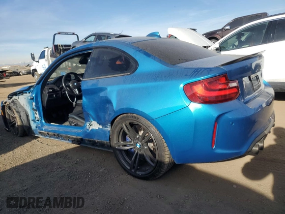 2016 BMW M2 with VIN WBS1H9C52GV351930, listed as a Copart auction lot 86610764 with 55,473 mi miles and Salvage Title. Bid and sale history available at carsss.com. Image 2.
