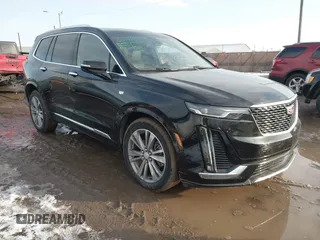 2025 Cadillac XT6 FWD Premium Luxury with VIN 1GYKPCRS6SZ104902, listed as a IAAI auction lot 41565224 with 4,735 mi miles. Bid and sale history available at carsss.com. Image 1.