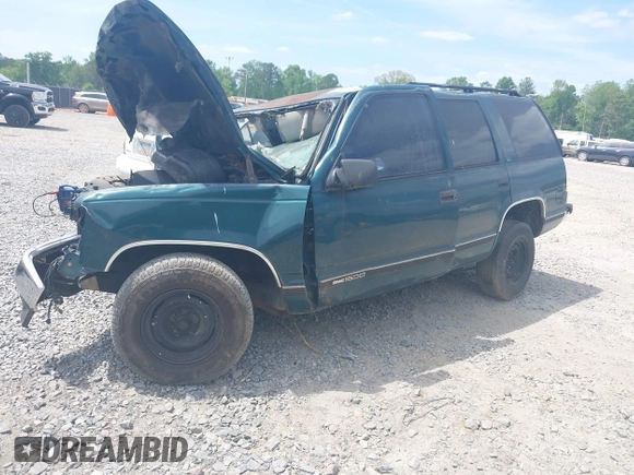 1996 GMC Yukon with VIN 1GKEC13R7TJ704518, listed as a IAAI auction lot 42095936 with 1 mi miles. Bid and sale history available at carsss.com. Image 2.