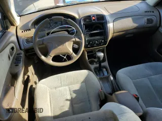 1999 Mazda Protege DX z VIN JM1BJ2227X0106522, wystawiony jako Copart lot #52423565 z przebiegiem 206 260 mil mil oraz Szkoda całkowita • Salvage title. Historia ofert i sprzedaży dostępna na DreamBid. Obrazek 8.