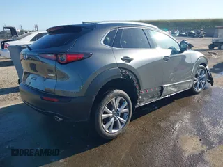 2022 Mazda CX-30 S Premium with VIN 3MVDMBDL0NM413867, listed as a IAAI auction lot 42082560 with 12,375 mi miles and . Bid and sale history available at DreamBid. Image 4.