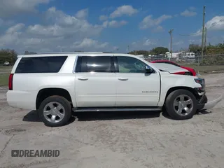 2017 Chevrolet Suburban Premier with VIN 1GNSKJKC0HR288648, listed as a IAAI auction lot 41579677 with Not Provided miles and . Bid and sale history available at DreamBid. Image 12.