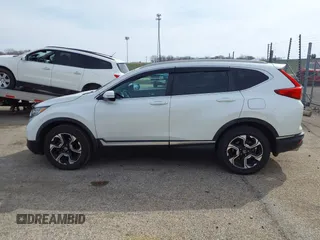 2017 Honda CR-V Touring with VIN 5J6RW2H95HL044505, listed as a IAAI auction lot 41856975 with 117,826 mi miles. Bid and sale history available at carsss.com. Image 14.