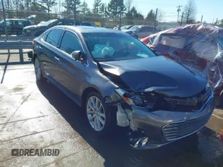 2014 Toyota Avalon Limited with VIN 4T1BK1EB8EU110700, listed as a IAAI auction lot 41597785 with 100,559 mi miles. Bid and sale history available at carsss.com. Image 1.