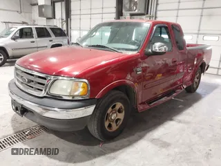 2002 Ford F-150 XL with VIN 1FTRX17L12NA36715, listed as a IAAI auction lot 41850555 with 174,012 mi miles. Bid and sale history available at carsss.com. Image 2.