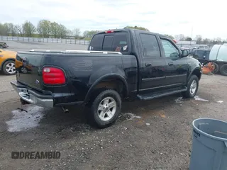 2002 Ford F-150 XLT with VIN 1FTRW08L32KD90202, listed as a IAAI auction lot 41850546 with 256,807 mi miles. Bid and sale history available at carsss.com. Image 4.