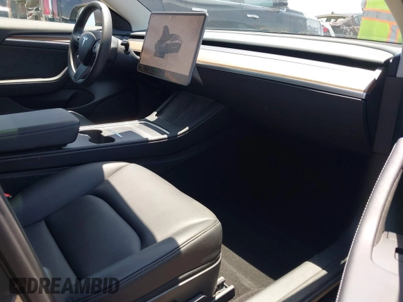 2023 Tesla Model 3 with VIN 5YJ3E1EA1PF545402, listed as a IAAI auction lot 42671354 with 37,948 mi miles and . Bid and sale history available at DreamBid. Image 5.