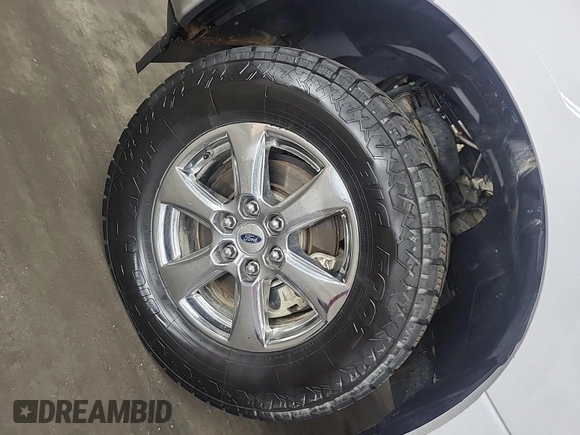 2018 Ford F-150 XL with VIN 1FTEW1E59JKD11351, listed as a IAAI auction lot 42663848 with 128,761 mi miles and . Bid and sale history available at DreamBid. Image 3.