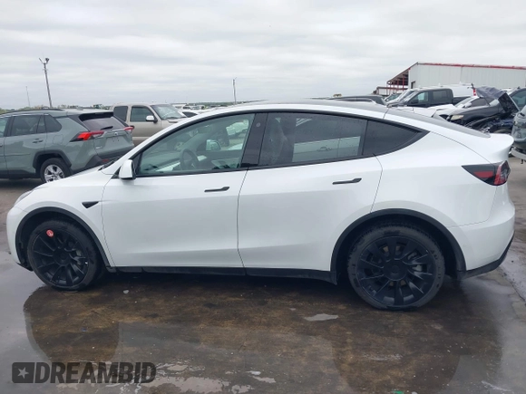 2022 Tesla Model Y Long Range z VIN 7SAYGDEE2NF420882, wystawiony jako IAAI lot #42023642 z przebiegiem 19 783 mil mil oraz . Historia ofert i sprzedaży dostępna na DreamBid. Obrazek 14.