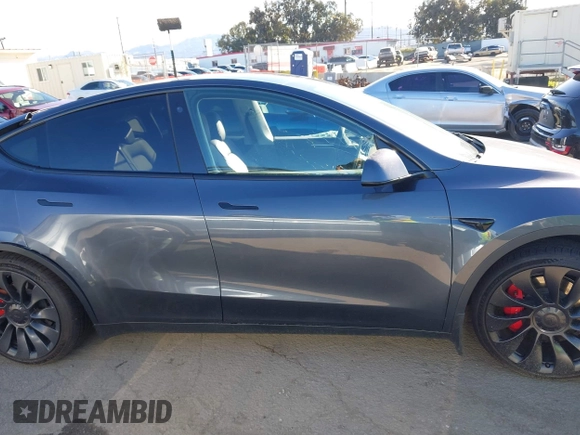 2022 Tesla Model Y Performance with VIN 7SAYGDEF7NF562895, listed as a IAAI auction lot 41692864 with 29,904 mi miles and . Bid and sale history available at DreamBid. Image 12.