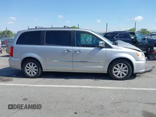 2012 Chrysler Town & Country Touring L with VIN 2C4RC1CG1CR245008, listed as a IAAI auction lot 41951680 with 98,656 mi miles and . Bid and sale history available at DreamBid. Image 13.