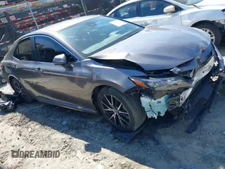 2023 Toyota Camry SE z VIN 4T1G11AK3PU101131, wystawiony jako IAAI lot #41836695 z przebiegiem 36 186 mil mil oraz . Historia ofert i sprzedaży dostępna na DreamBid. Obrazek 1.