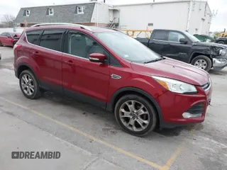 2015 Ford Escape Titanium with VIN 1FMCU0JX2FUA04643, listed as a IAAI auction lot 41019925 with 79,989 mi miles. Bid and sale history available at carsss.com. Image 1.