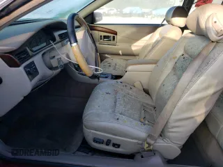 1998 Cadillac Eldorado z VIN 1G6EL12Y4WU610896, wystawiony jako Copart lot #74662244 z przebiegiem Nie podano mil oraz Szkody całkowita. Historia ofert i sprzedaży dostępna na DreamBid. Obrazek 7.