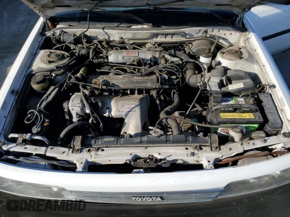 1990 Toyota Camry z VIN JT2SV21E3L0349179, wystawiony jako Copart lot #75125234 z przebiegiem 138 635 mil mil oraz Czysty tytuł • Clean title. Historia ofert i sprzedaży dostępna na DreamBid. Obrazek 11.
