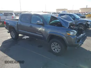 2016 Toyota Tacoma SR5 with VIN 5TFAX5GN0GX065186, listed as a IAAI auction lot 41468194 with 124,593 mi miles. Bid and sale history available at carsss.com. Image 1.