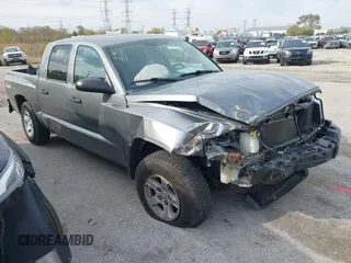 2005 Dodge Dakota SLT with VIN 1D7HW48N25S133823, listed as a IAAI auction lot 40863632 with 190,080 mi miles and . Bid and sale history available at DreamBid. Image 1.