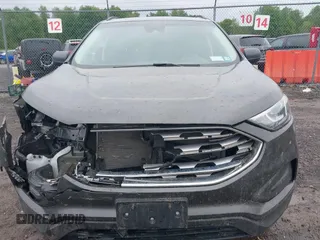 2020 Ford Edge SE z VIN 2FMPK4G94LBB18927, wystawiony jako IAAI lot #42332042 z przebiegiem 86 720 mil mil oraz . Historia ofert i sprzedaży dostępna na DreamBid. Obrazek 13.